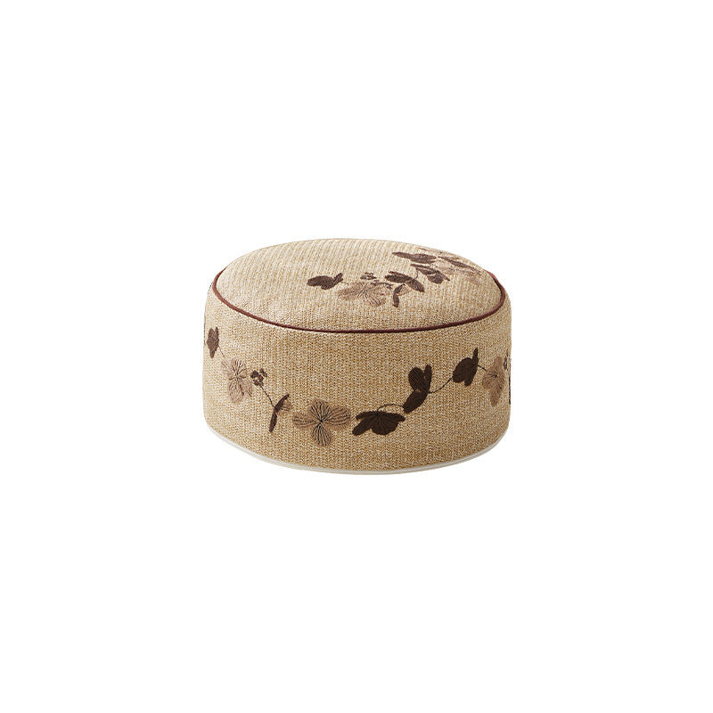 Round floor pouf seating with embroidered floral border Kalsten