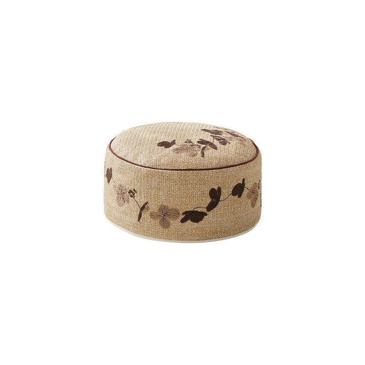Round floor pouf seating with embroidered floral border Kalsten