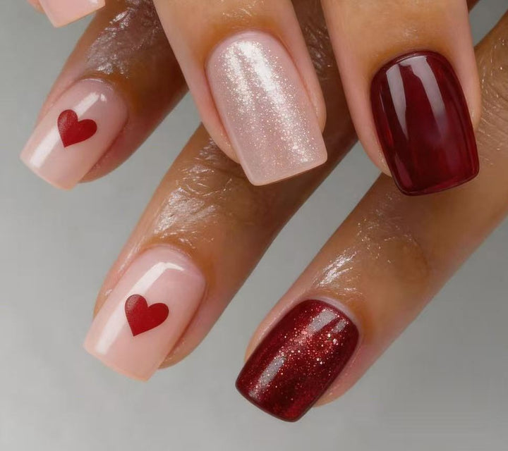 Art nail set with heart designs and glitter Kalsten