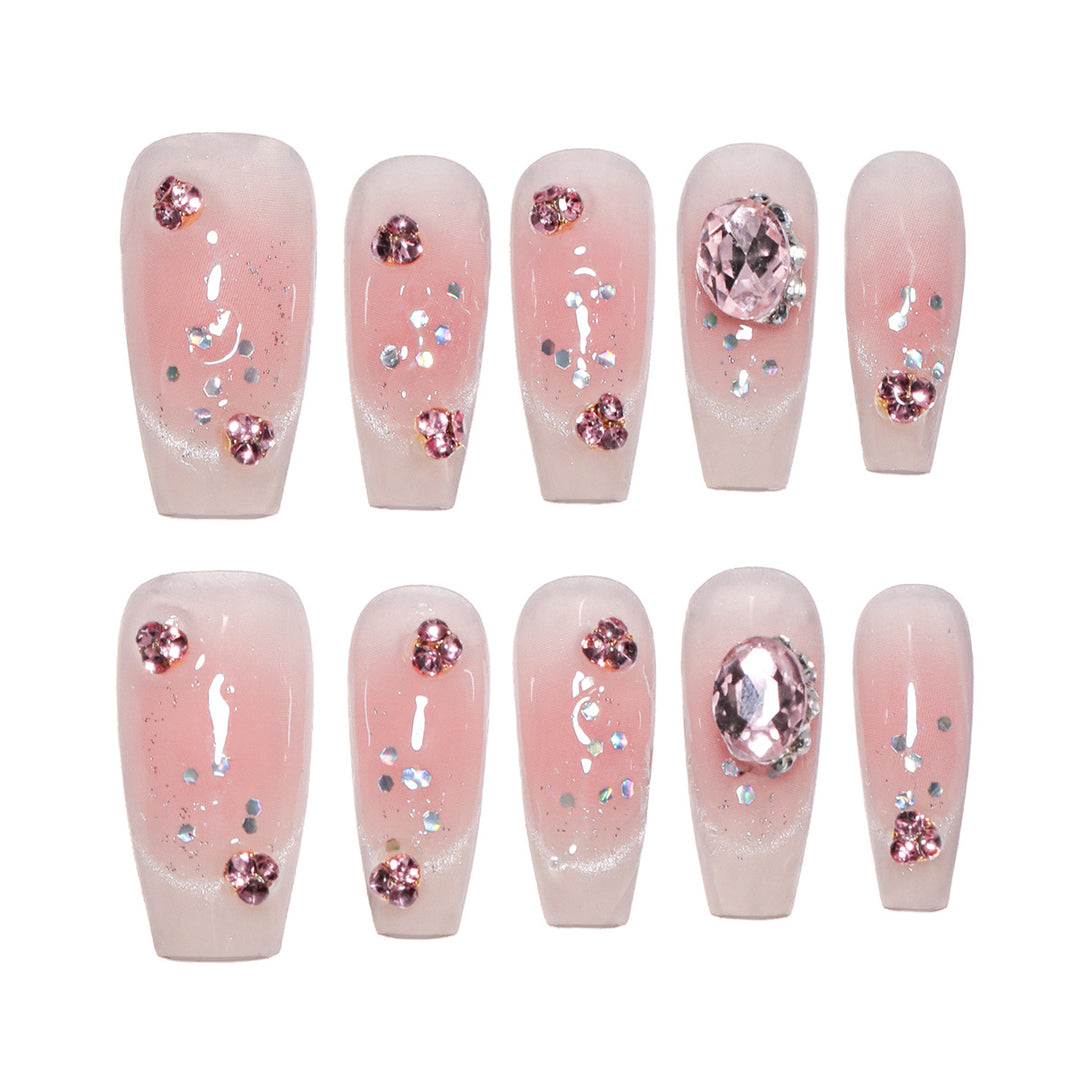 Artificial nail extensions with artistic glitter accents Kalsten