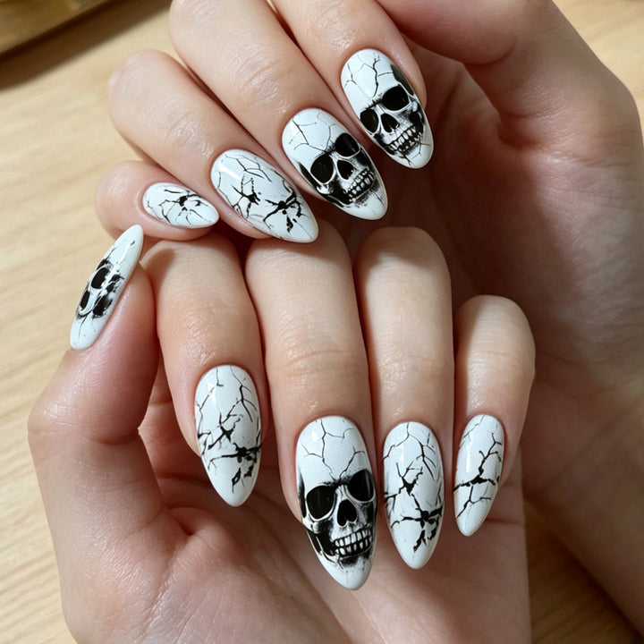 Artificial nails with playful skull design and crackle effects Kalsten