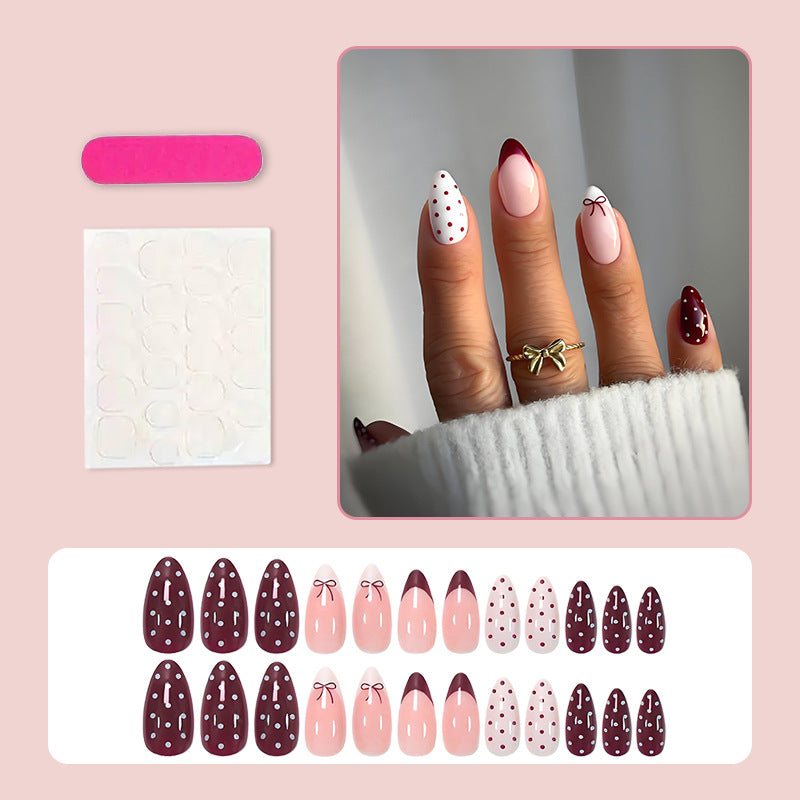Artificial nail set with elegant bow and dot motifs Kalsten