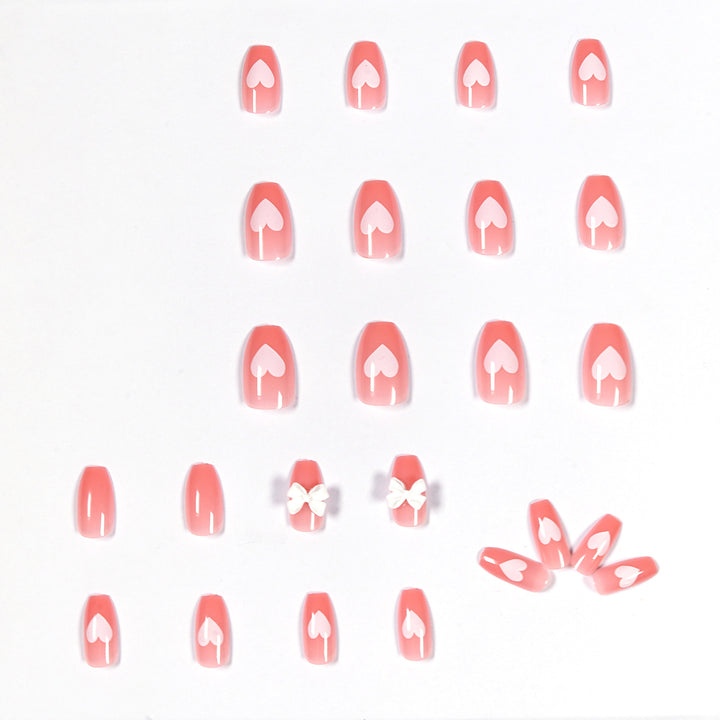 Artistic acrylic nails with heart and bow motifs Kalsten