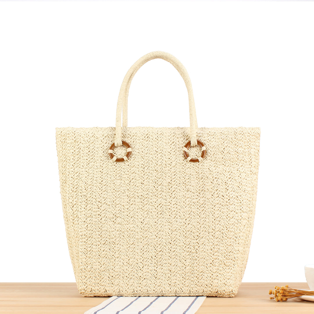 Beach bag made of natural woven material with sturdy carry handles Kalsten