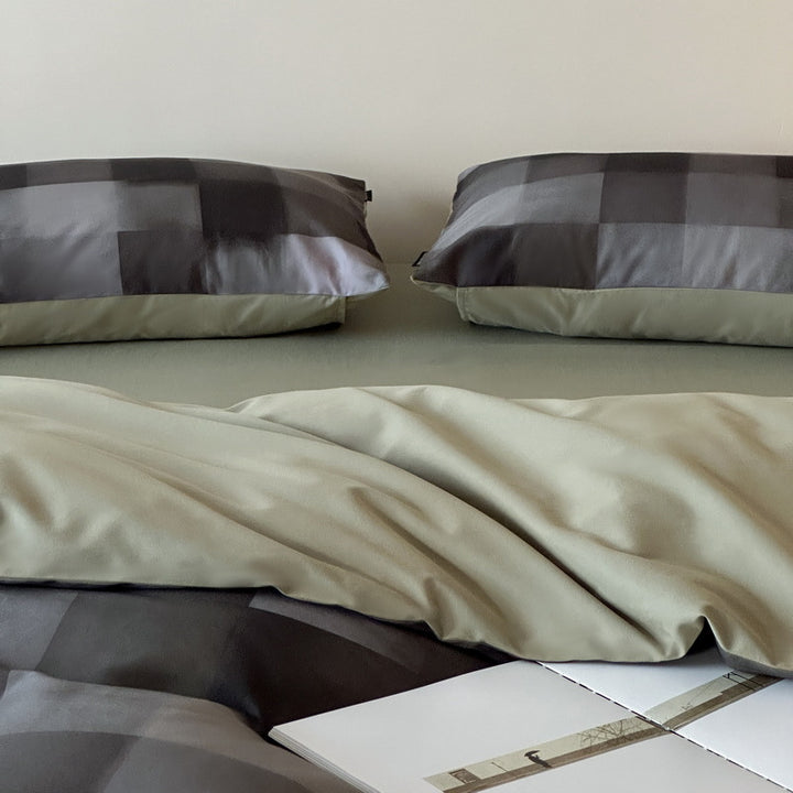 Reversible cotton satin bedding set with fine striped pattern and contrasting backside