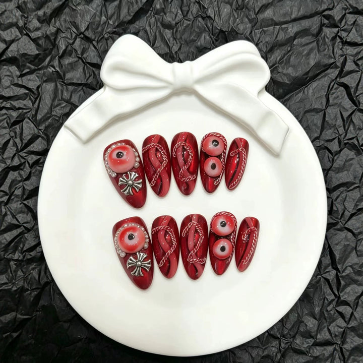 Artistic Press-On Nail Art Set with Unique Red Designs