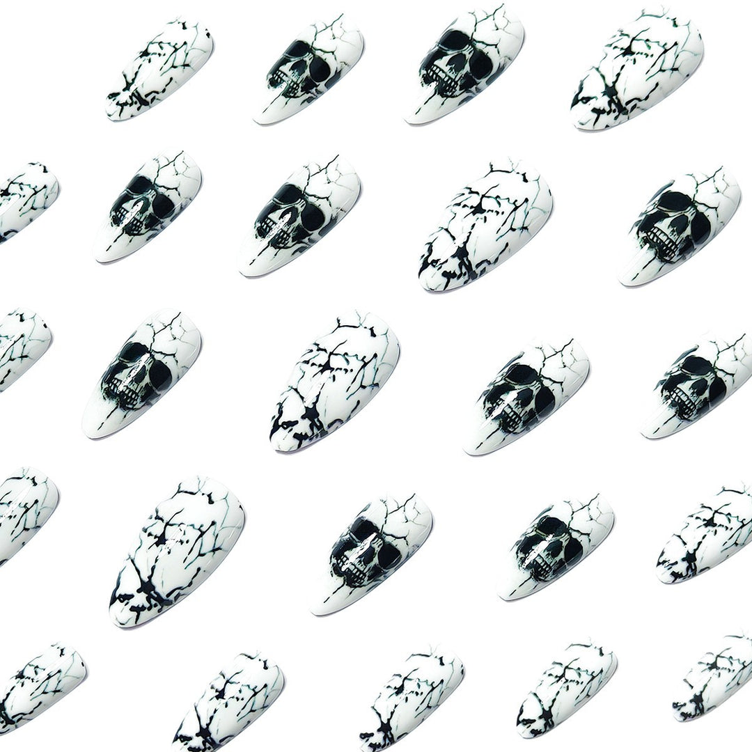 Artificial nails with playful skull design and crackle effects Kalsten