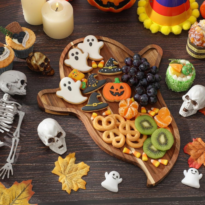 Skull-shaped cutting and serving board made of acacia wood with skull engraving
