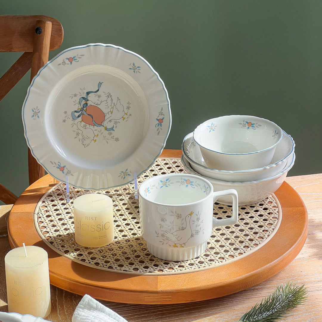 Decorative porcelain soup plate with ribbed edge and duck motif