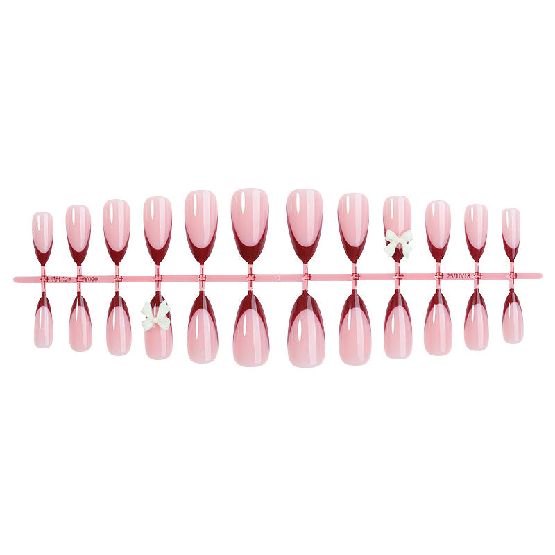 Acrylic nail set with creative French tip design and cute bows Kalsten