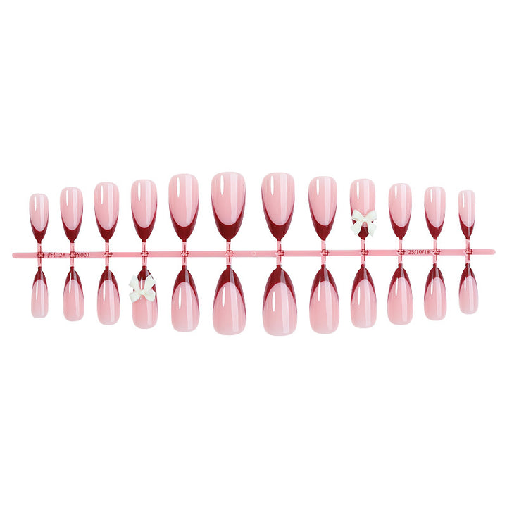 Acrylic nail set with creative French tip design and cute bows Kalsten