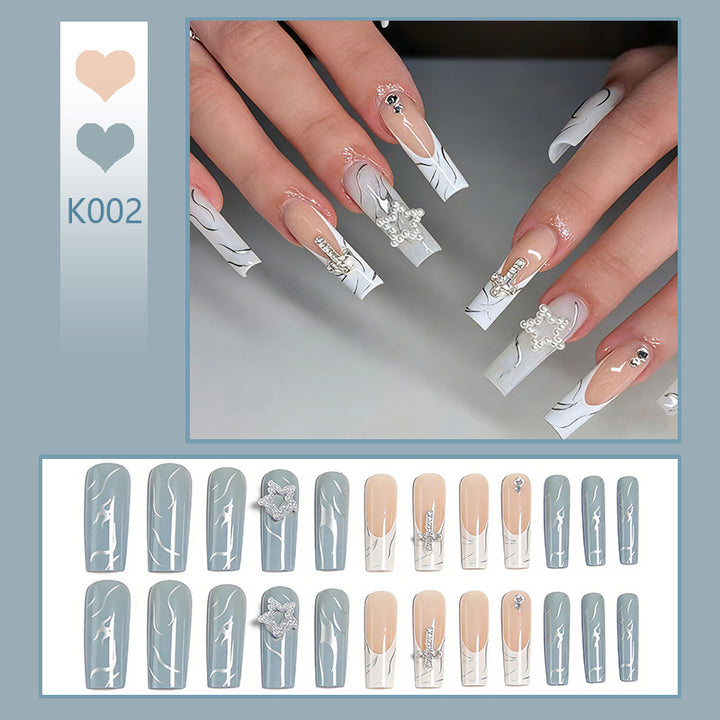 Artificial nails with luxurious marble design and radiant embellishments Kalsten
