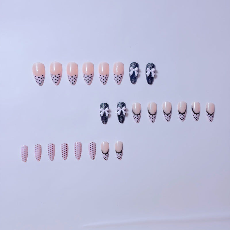 Elegant artificial nails with lace design and bow accents Kalsten