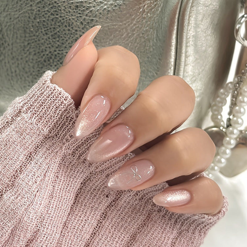 Artificial nail set with delicate glitter and elegant bow decorations Kalsten
