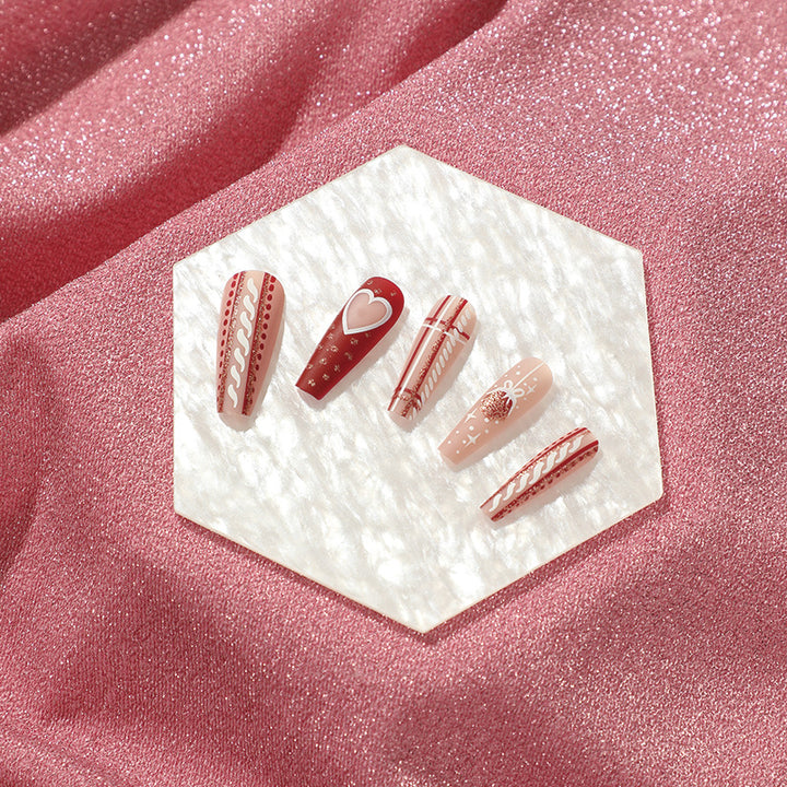 Artful nail art in festive design with heart and Christmas motifs Kalsten