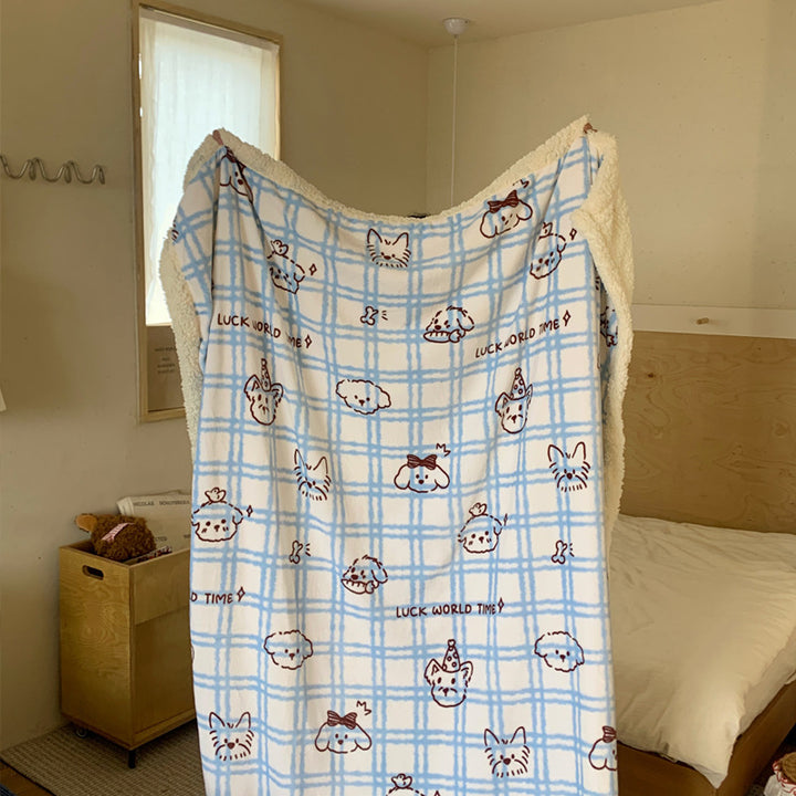 Reversible cuddle blanket with Sherpa fleece, cute dog illustrations and checkered pattern