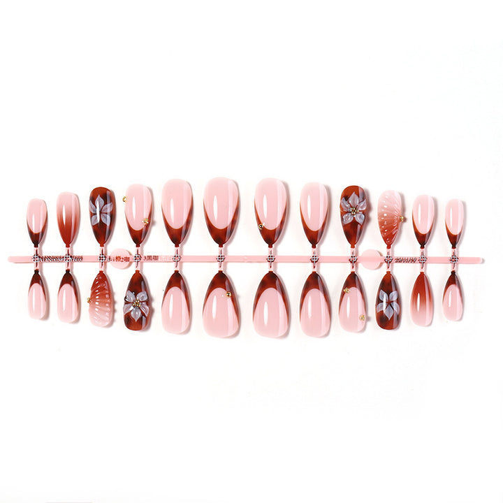Nail art set with detailed ombre design and creative flower accents Kalsten