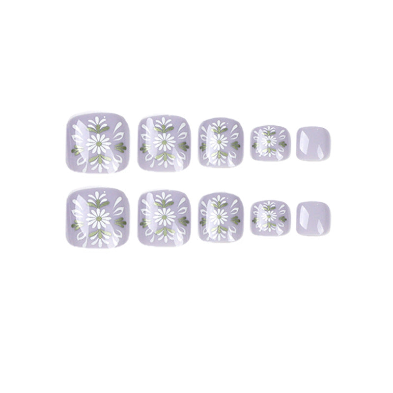 Artistic toenail design with elegant floral design Kalsten