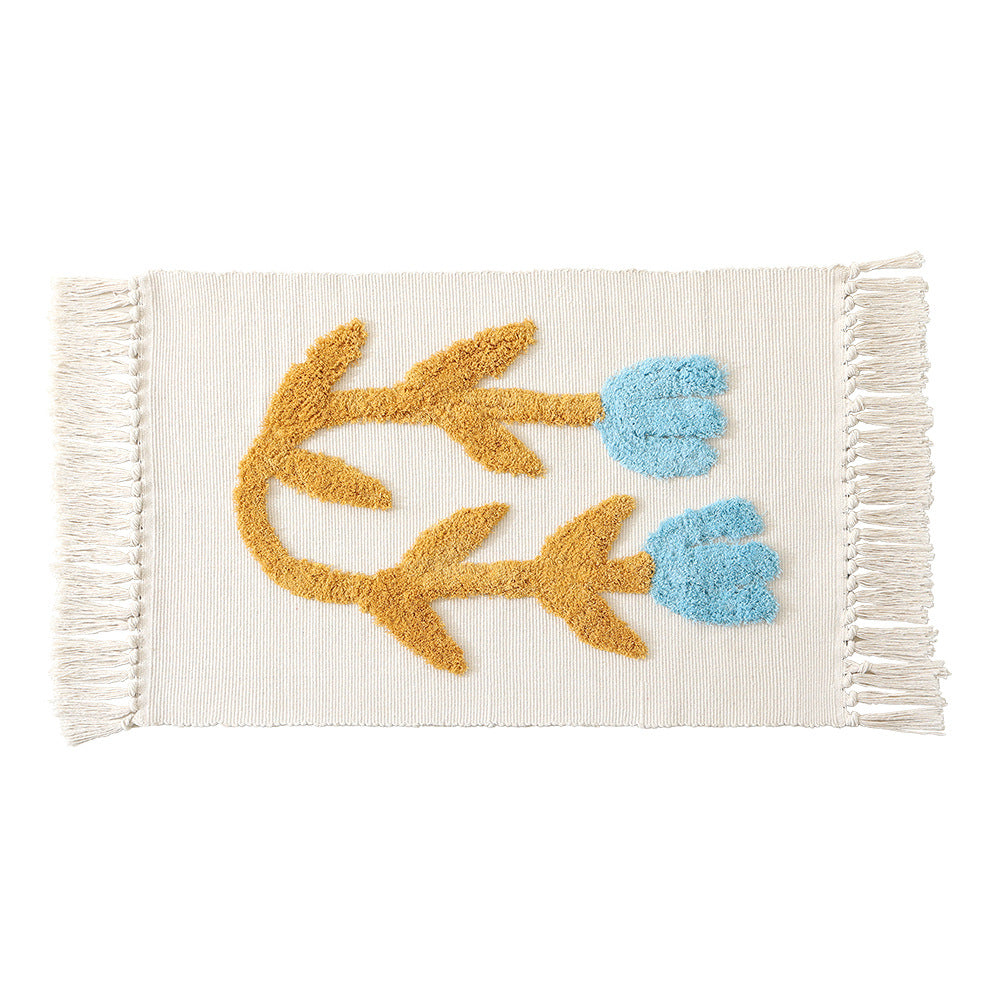 Handwoven cotton bath mat rug with tufted flower appliqué and tassels Kalsten