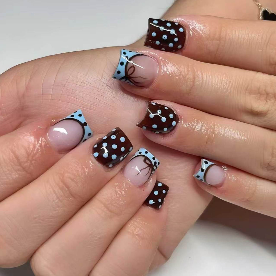 Artful nail extensions with playful dots and elegant design Kalsten