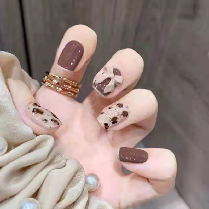 Artificial nails with heart accent and glamorous decorations Kalsten