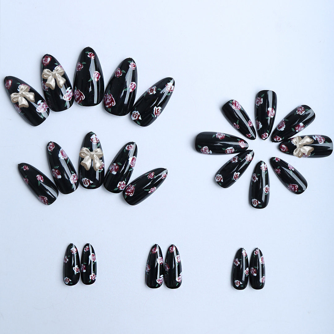 Artificial nails with floral decorations and glamorous bow detail Kalsten