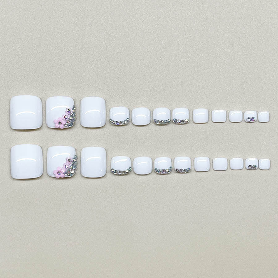Nail art set with elegant glitter embellishments and floral accents Kalsten