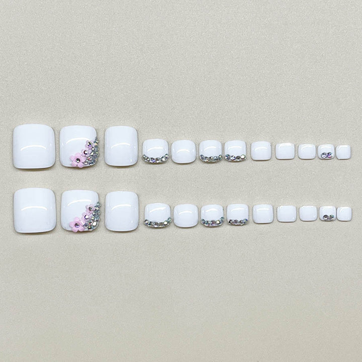 Nail art set with elegant glitter embellishments and floral accents Kalsten