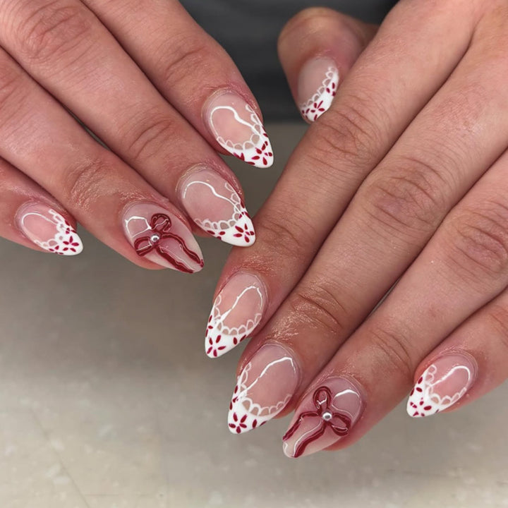 Artful stiletto nails with delicate floral accents Kalsten