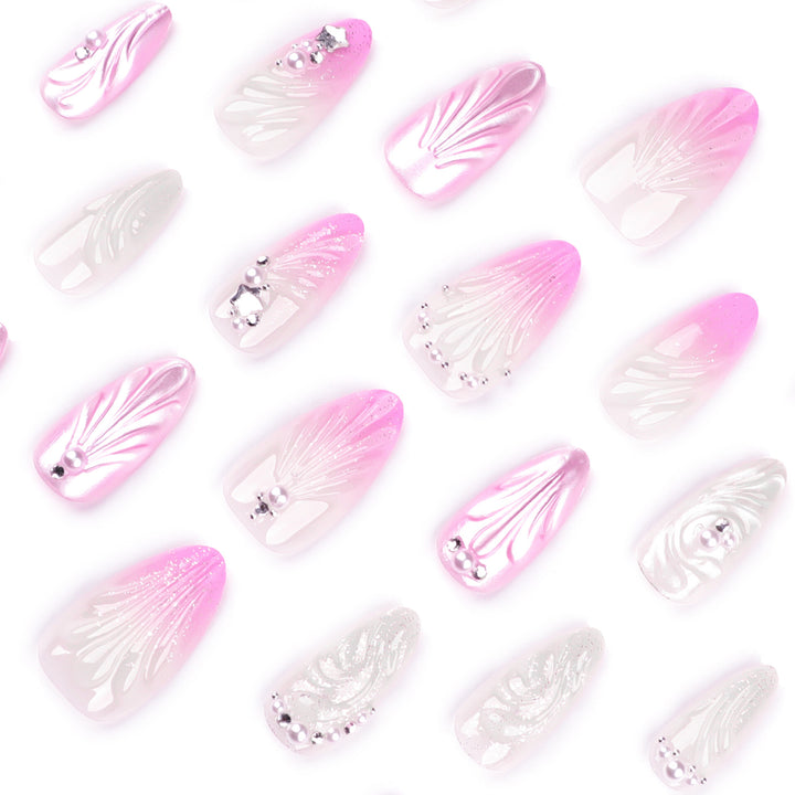 Artificial nail art with elegant swirl design and pearl embellishments Kalsten