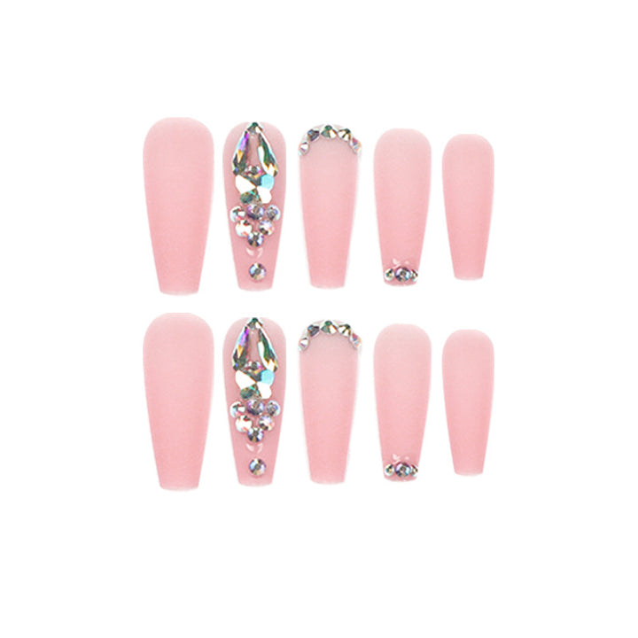 Artistic acrylic nails with glitter and rhinestone embellishments Kalsten