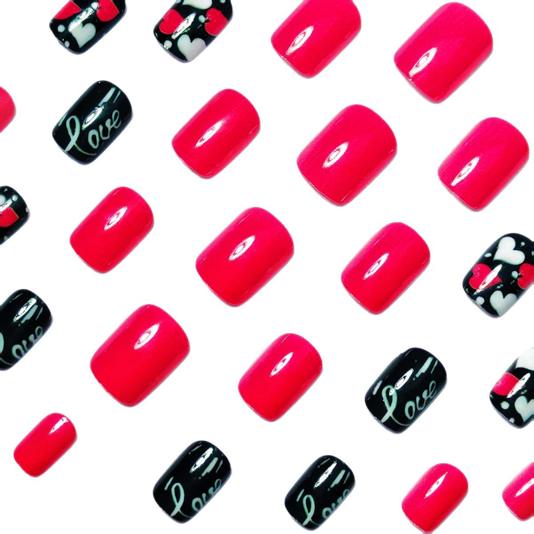 Acrylic nail design with hearts and kiss motifs Kalsten