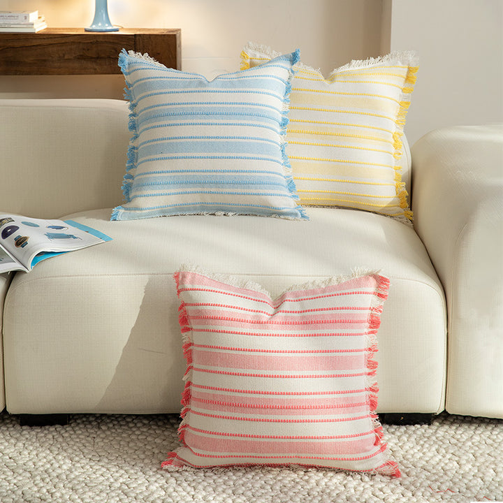 Square cushion cover made of hand-woven cotton blend with decorative fringe trim Kalsten