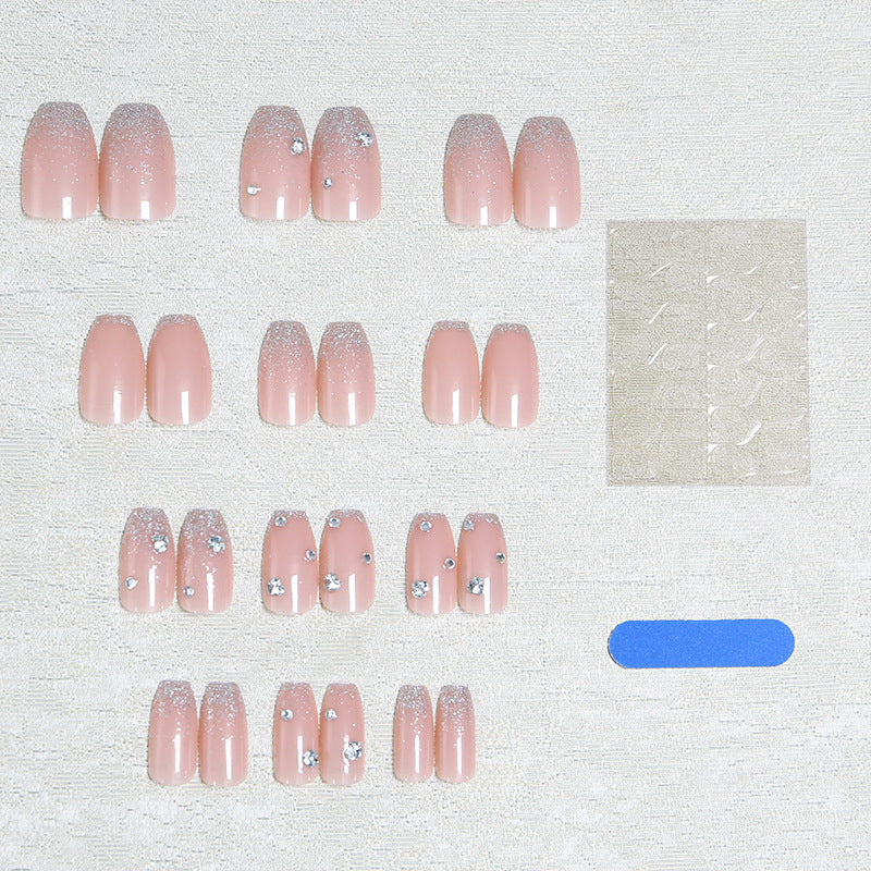 Glamorous artificial nails with glitter and rhinestone embellishments Kalsten