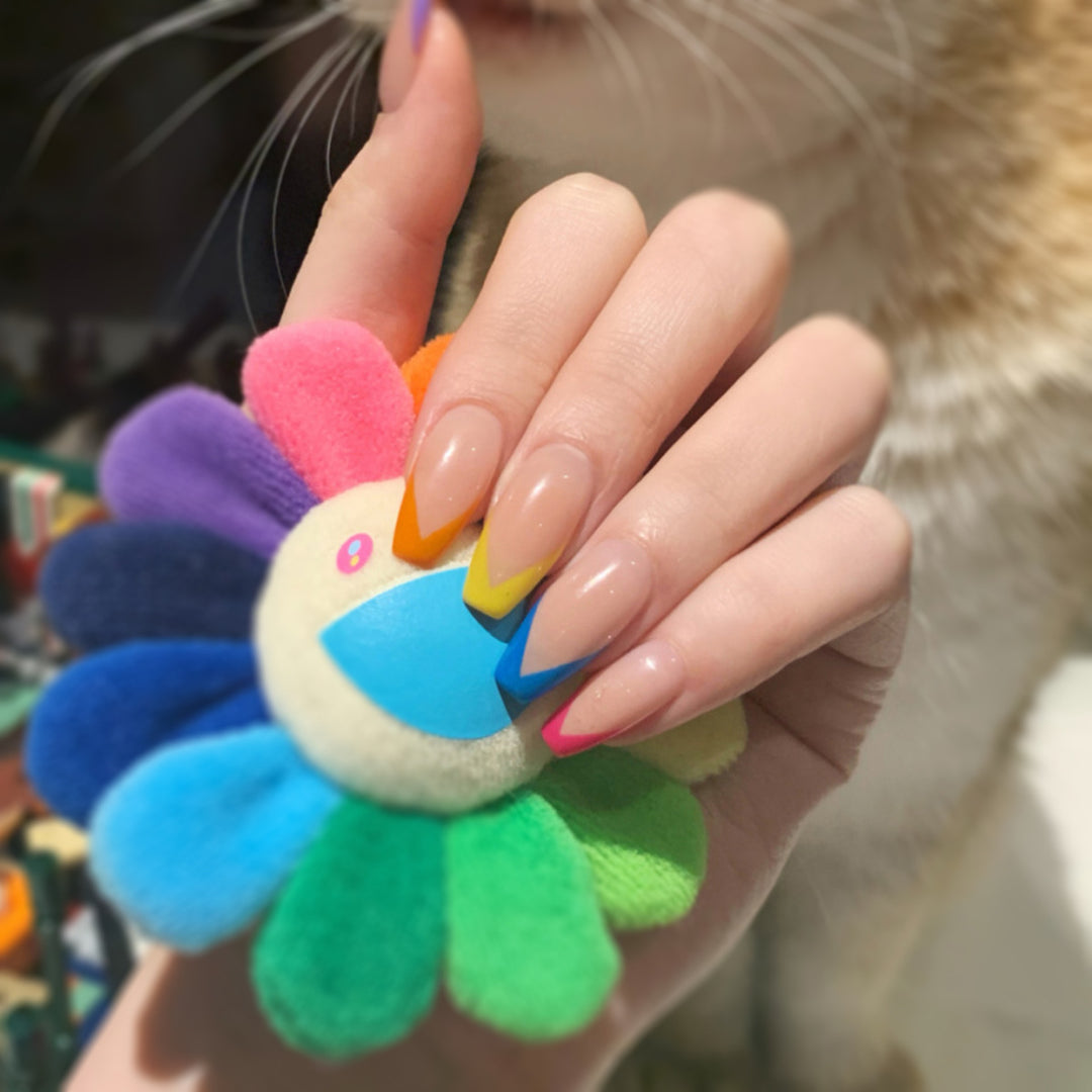 Artificial nail art with colorful tips and elegantly accented designs Kalsten