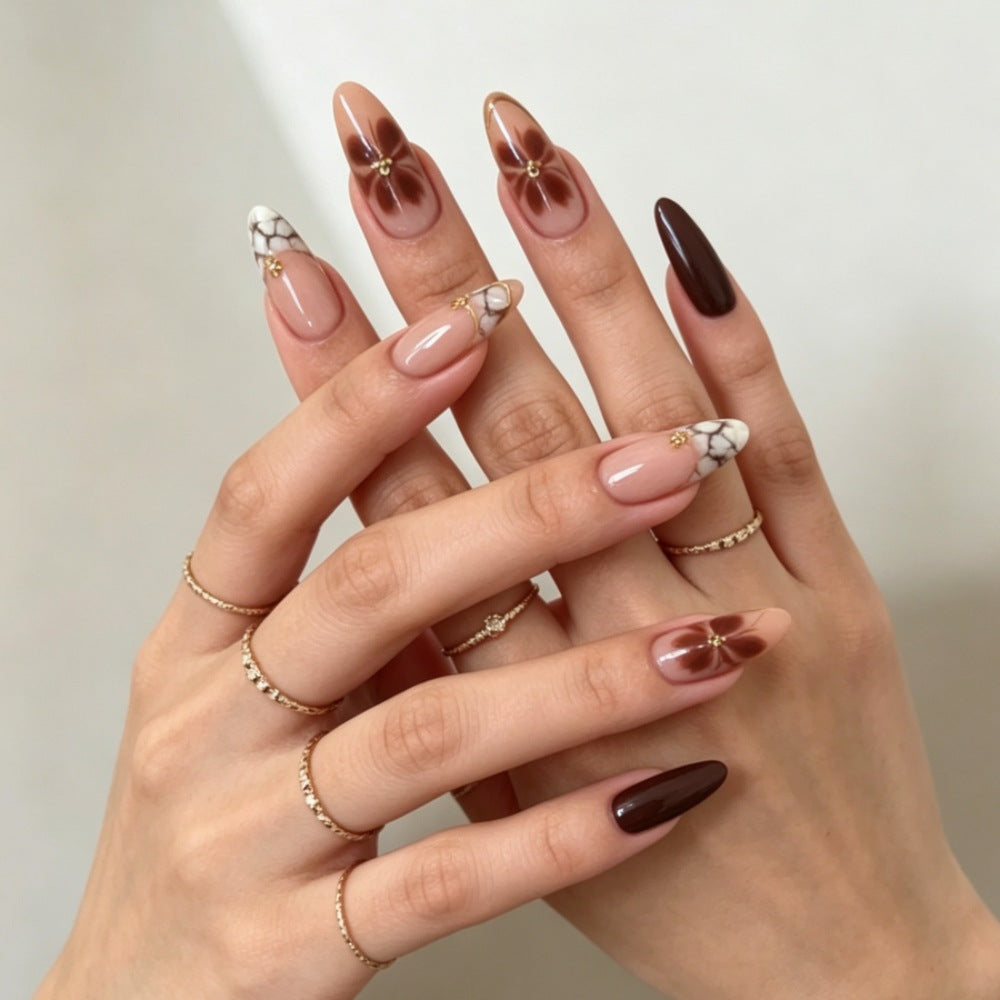 Artificial nails with elegant marble pattern and delicate accents Kalsten