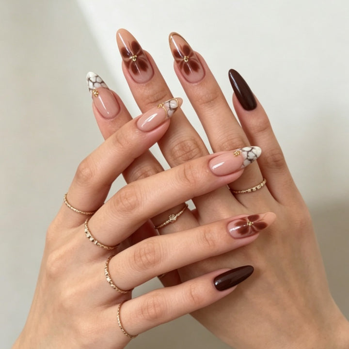 Artificial nails with elegant marble pattern and delicate accents Kalsten
