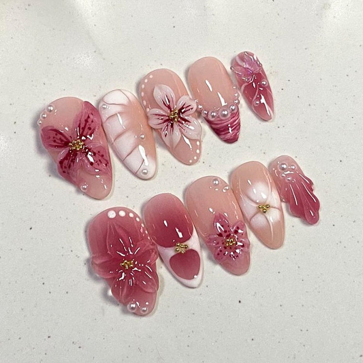Artificial nail set with floral design and glitter accents Kalsten
