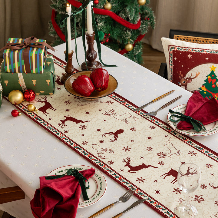 Table runner made of cotton blend fabric with a Christmas reindeer and star motif Kalsten