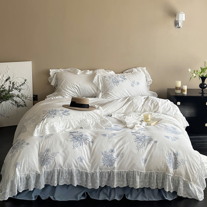 Embroidered bedding set in country house style with ruffled edging and eyelet lace