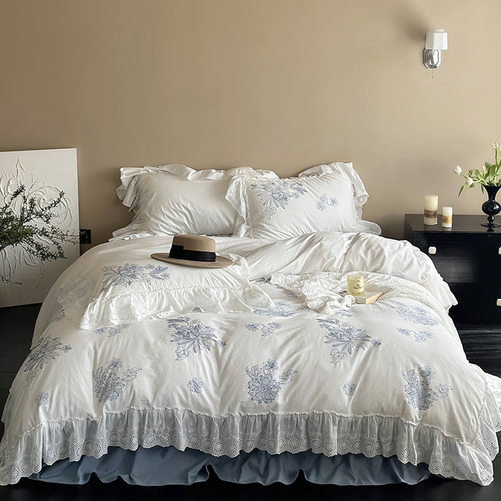 Embroidered bedding set in country house style with ruffled edging and eyelet lace