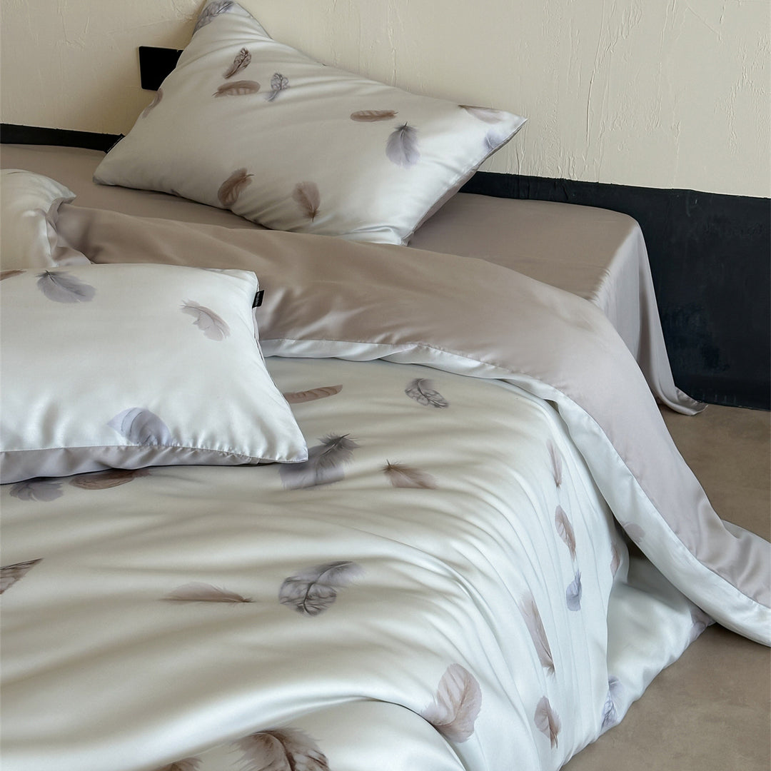 Luxurious satin bedding set with floral watercolor print, ruffled edges and reversible function