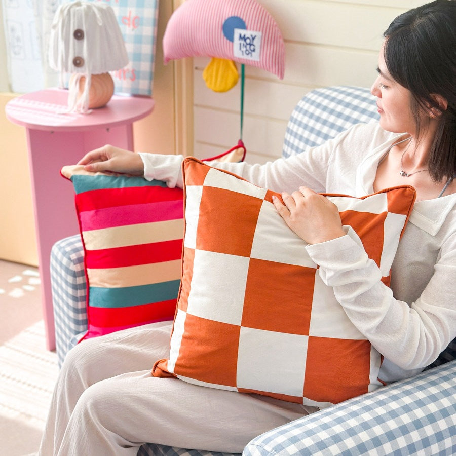 Decorative checkered cushion cover made of velvet velours with piping and concealed zipper