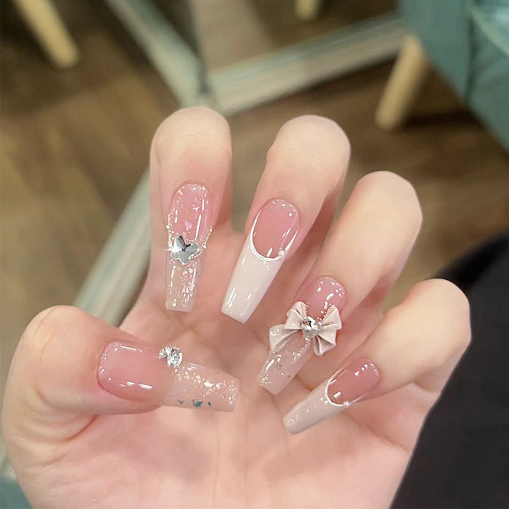 Artificial nails with glitter accents and playful motifs Kalsten
