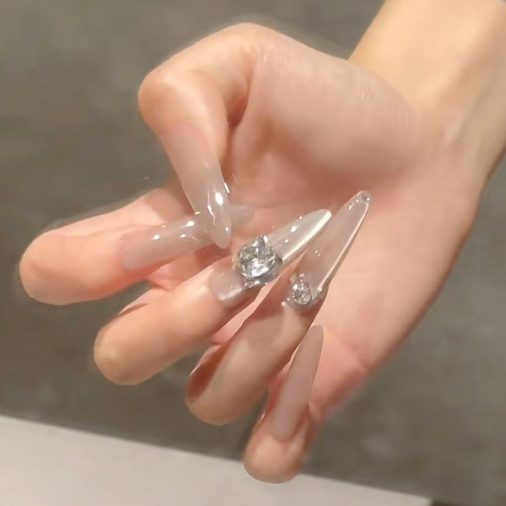 Acrylic nail set with glitter design and elegant 3D applications Kalsten
