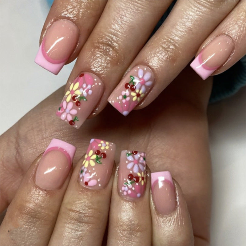 Artful nail design with colorful floral patterns Kalsten