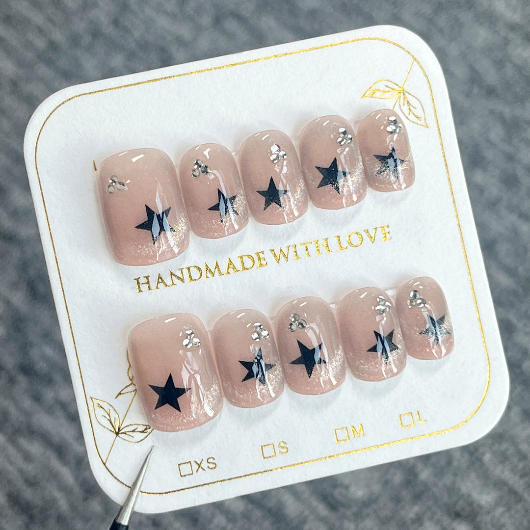 Artistic acrylic nails with glamorous star motifs Kalsten