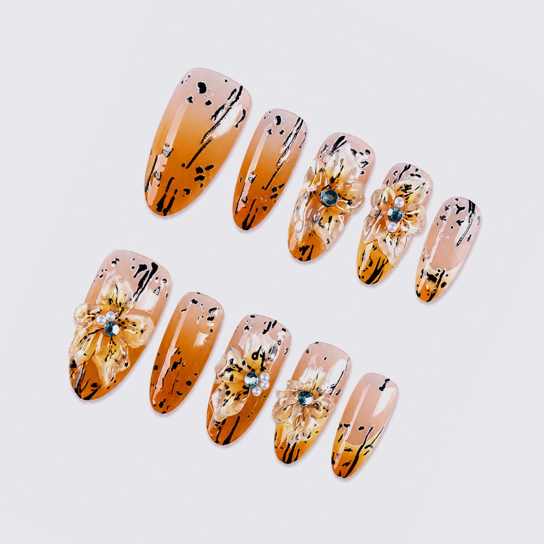Artificial nail set with elegant floral design and sophisticated glitter elements Kalsten