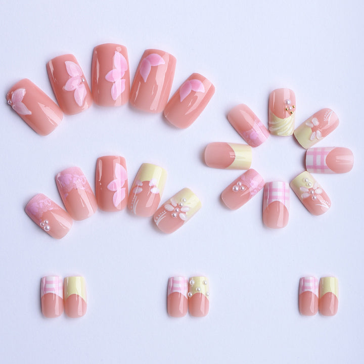 Artificial nails with creative floral designs and glitter accents Kalsten