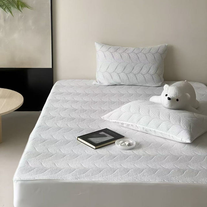Quilted mattress topper set with non-slip underside, breathable microfiber and pillowcases